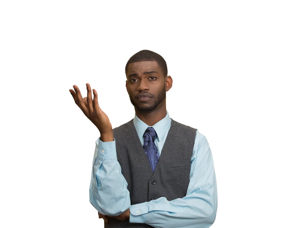 Closeup portrait dumb clueless young executive man, arm out asking why what problem so who cares, I dont know, isolated white color background. Negative human emotion facial expression feelings Closeup portrait dumb clueless young executive man, arm out asking why what problem so who cares, I dont know, isolated white color background. Negative human emotion facial expression feelings