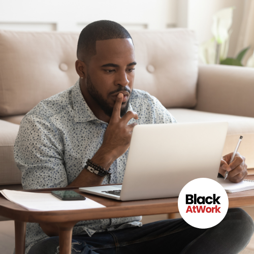 Black man thoughtful about what he's seeing on a computer